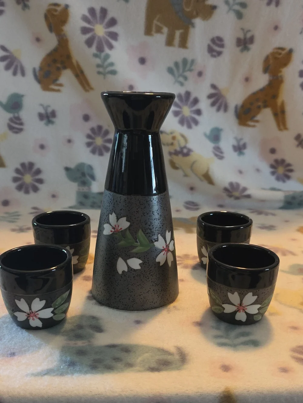 Japanese-style sake set includes one ceramic flagon wine pot and four small drin